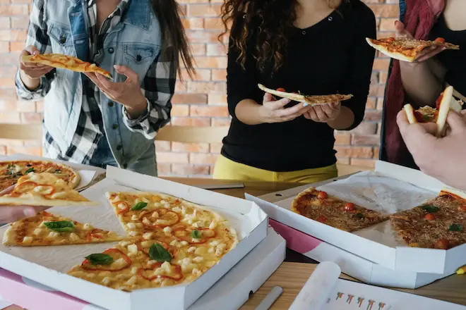 Workers eating Pizza